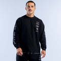 Black long-sleeve crewneck top with white sleeve lettering and small chest logos