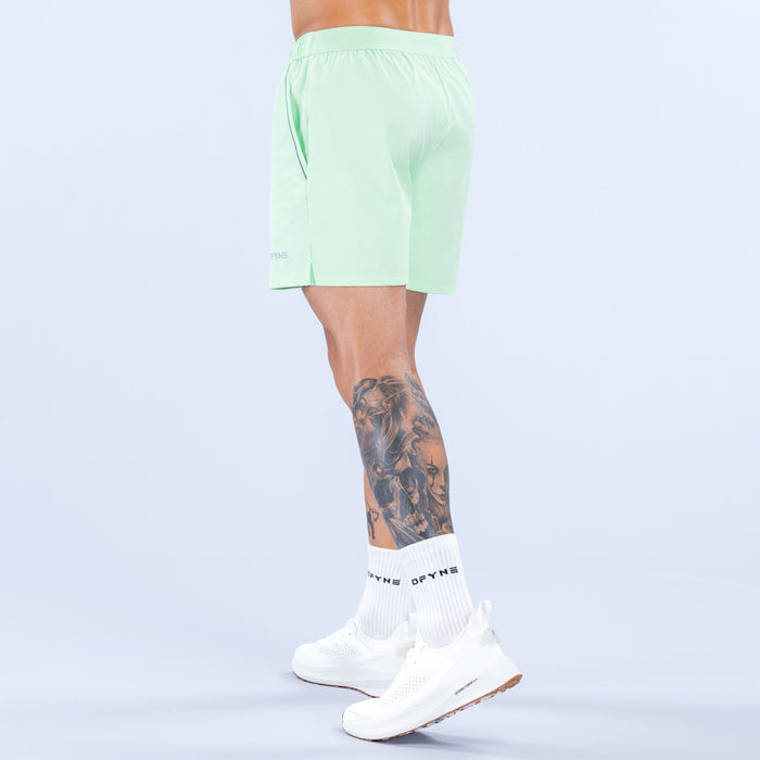 Light green training shorts, back view with elastic waistband and 6-inch inseam