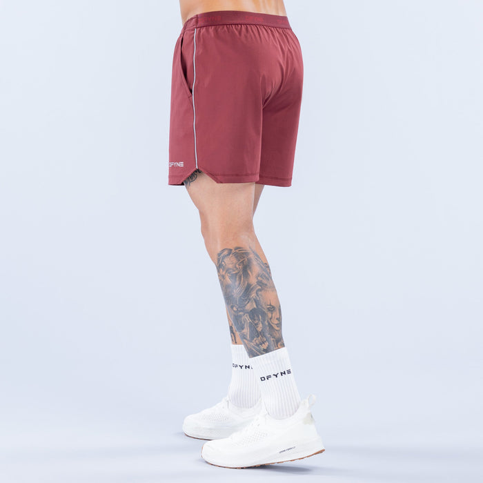 Maroon training shorts back view with elastic waistband and side logo tag