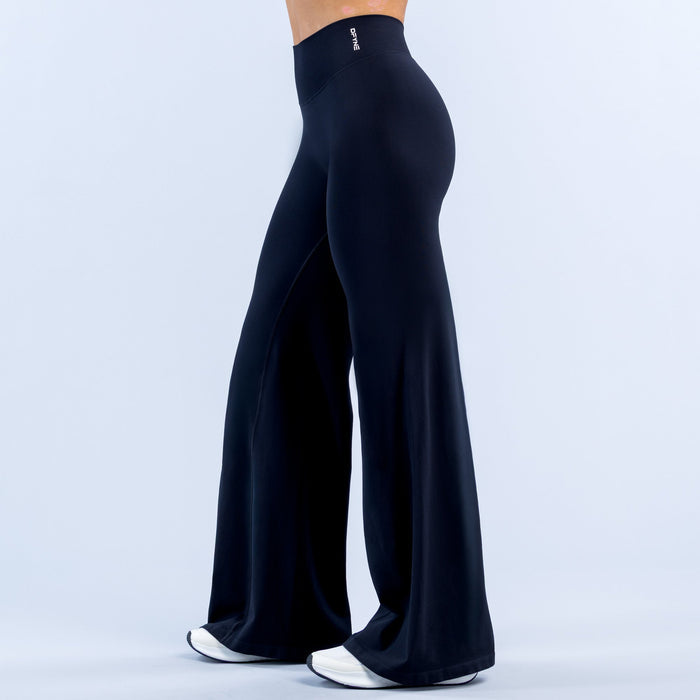 Dark navy flared leggings, back view with high-rise waistband and wide bell legs