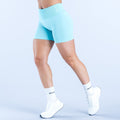 Light blue fitted 4.5-inch performance shorts, mid-thigh hem