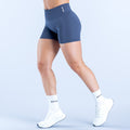 Navy 4.5-inch compression shorts with elastic waistband and small logo at hem
