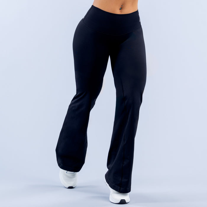 Black flare yoga leggings with high-rise waistband and wide bell hems