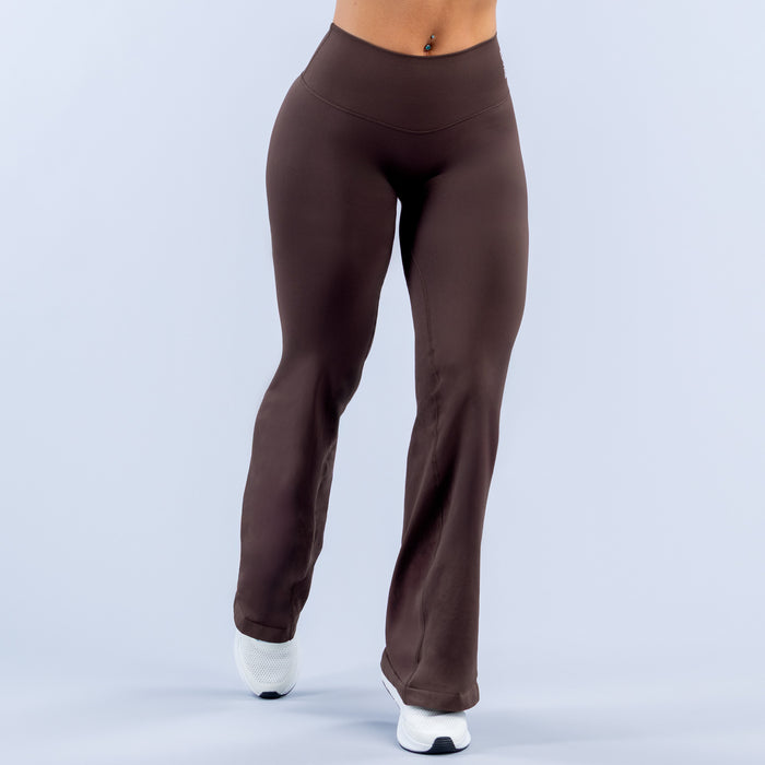 Dark brown full-length flare leggings with high waistband and clean hems