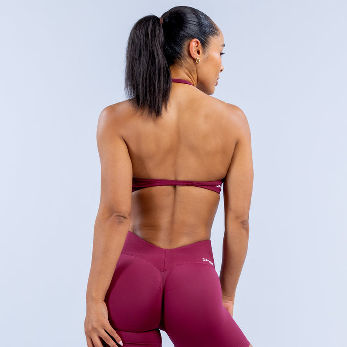 Dynamic high-neck halter bra, back view, dark berry with cross strap at neck