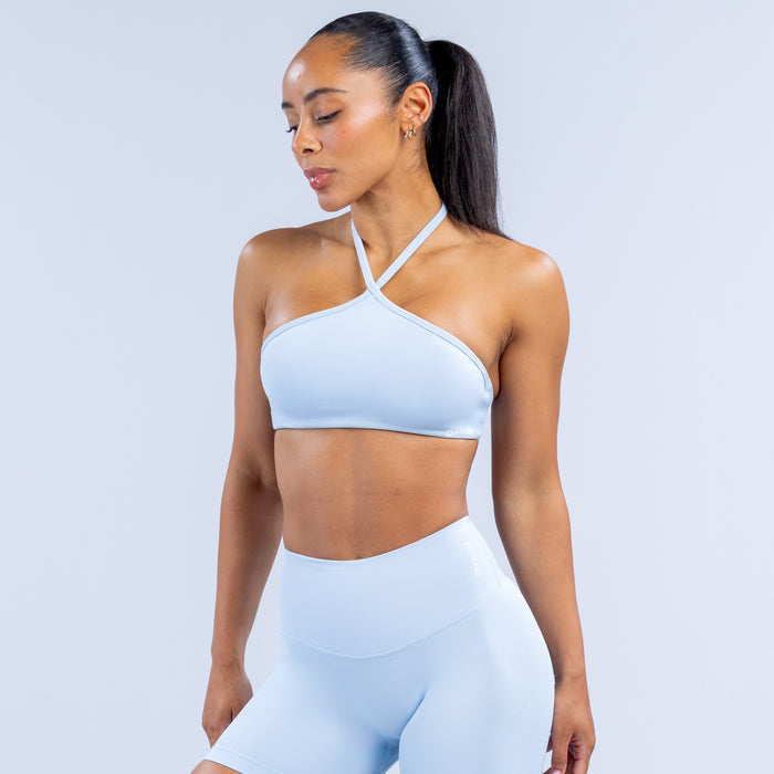 Light blue high-neck halter bra with smooth cups and racerback-style straps