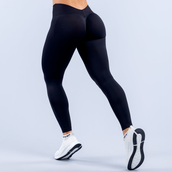 Black high-waist leggings with tapered ankle cuffs and sleek fit