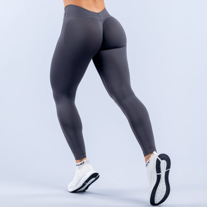 Black fitted workout leggings, smooth seams and contoured hip, mid-rise