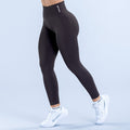 Black full-length performance leggings with snug fit and visible waistband logo
