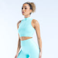 Light blue quarter-zip sleeveless sports tank with high neck and cropped fit