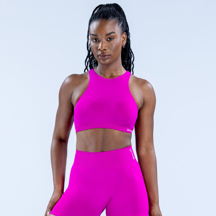 Women's magenta racerback sports bra with high neckline