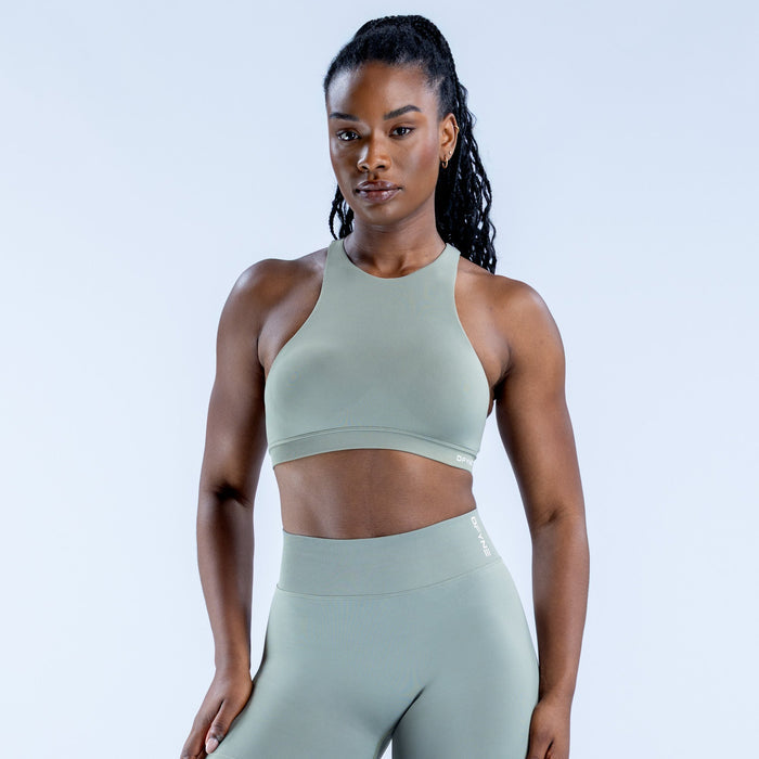 Sage green racerback sports bra with high neckline and racer straps