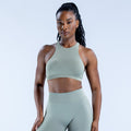 Sage green racerback sports bra with high neckline and racer straps