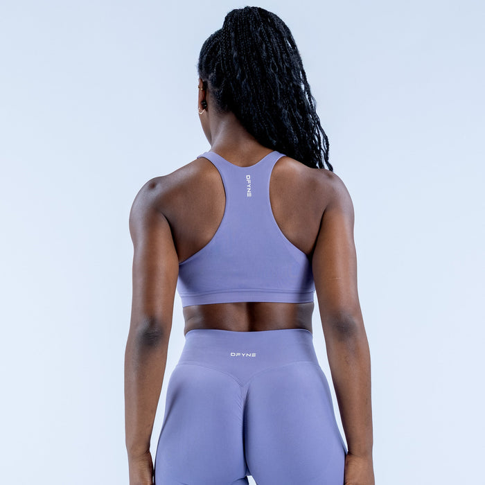 Lavender racerback sports bra shown from back, cropped length and racerback straps