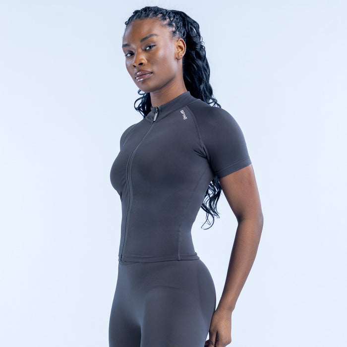 Black short-sleeve zip-up athletic top with raised collar and fitted sleeves