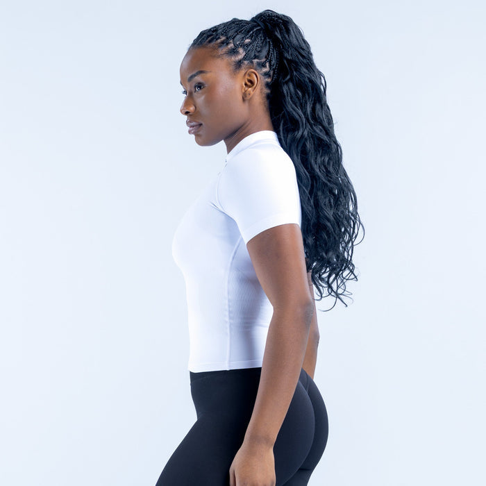 White short-sleeve zip-up athletic top, fitted side profile with front zipper