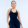 Women's black strappy sports top with scoop neckline, fitted racerback