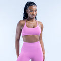 Pink sports bra with scoop front and thin adjustable straps