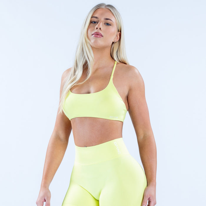 Neon yellow sports bra with scoop neckline and smooth supportive fit