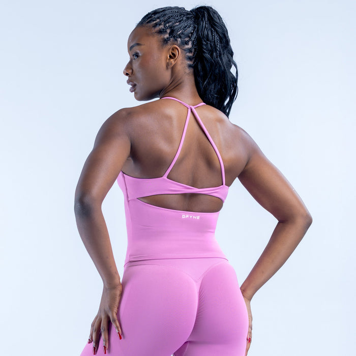 Pink sports bra top with open back and crisscross straps