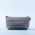 Padded zip pouch in dark gray with front seam and small logo patch