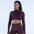 Maroon impact crop jacket with quarter zip and long sleeves, fitted athletic top