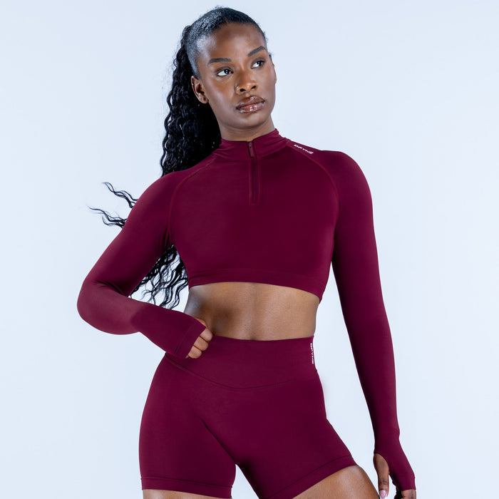 Burgundy long-sleeve zip-front crop top and high-waist shorts set, front view