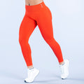 Impact leggings in bright orange, full-length with high waistband
