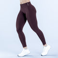 Dark plum impact leggings with high-rise waistband and ankle-length fit