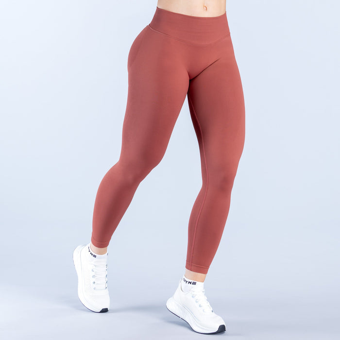 Maroon impact leggings front view with high waistband and tapered legs