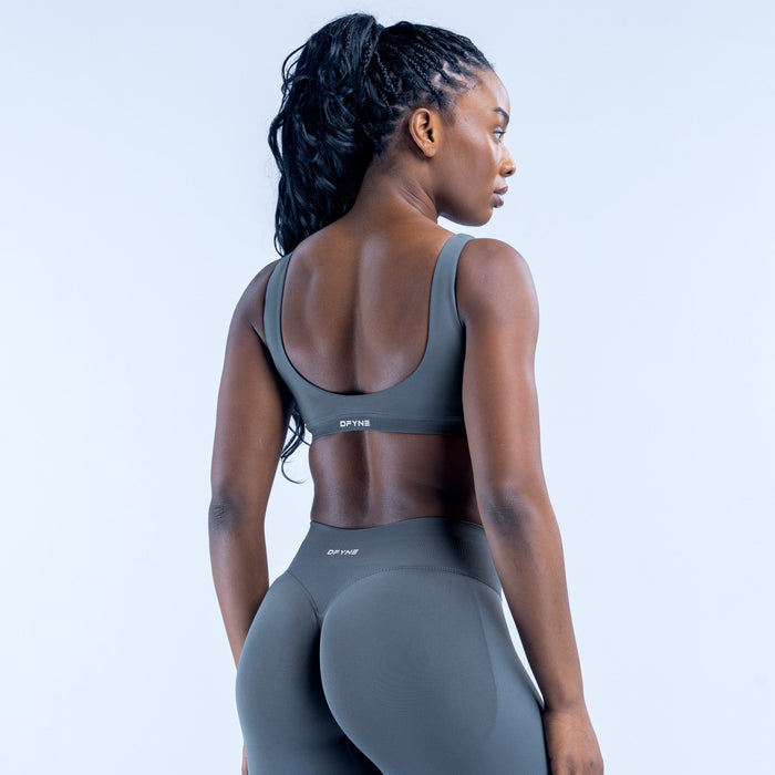 Scoop-back sports bra with racerback straps and elastic hem band, dark gray