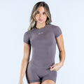 Fitted dark gray short-sleeve compression top with crew neck and chest logo