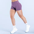 Purple 4.5-inch fitted athletic shorts, elastic waistband, no visible pockets