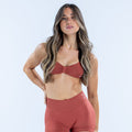 Strappy bra in rust red with ruched cups and thin adjustable straps