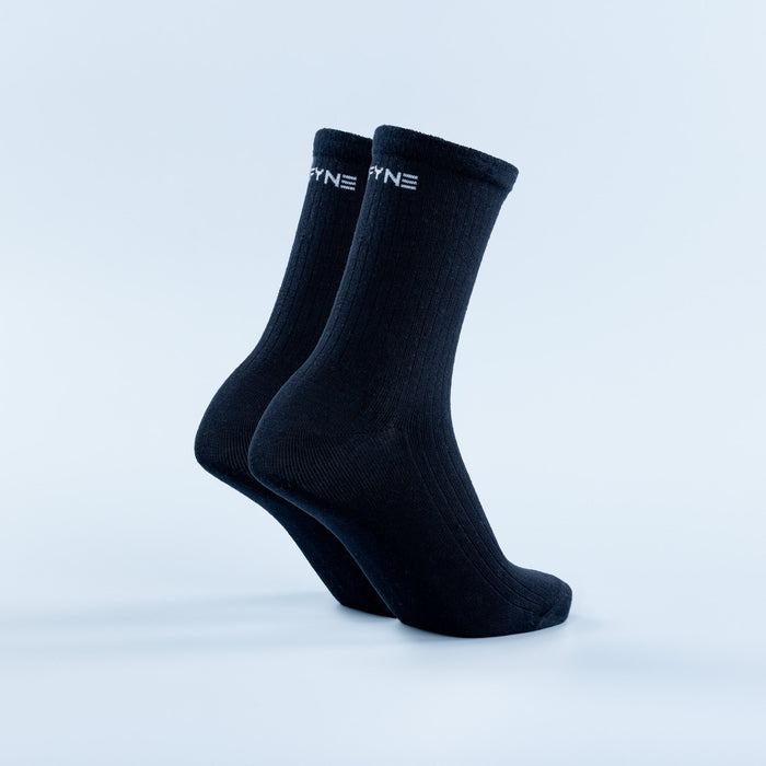 Dark navy crew socks with ribbed knit and small logo at the cuff