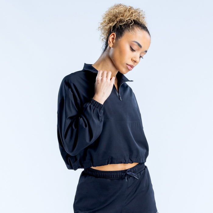 Black cropped zip-up jacket with high collar, quarter zip, relaxed balloon sleeves
