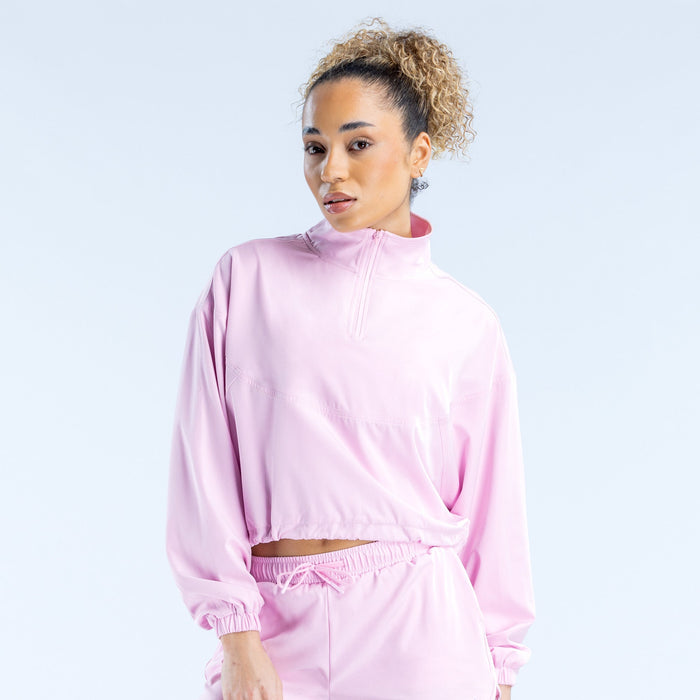 Pink cropped zip jacket front view with high collar, zip placket, and gathered waist