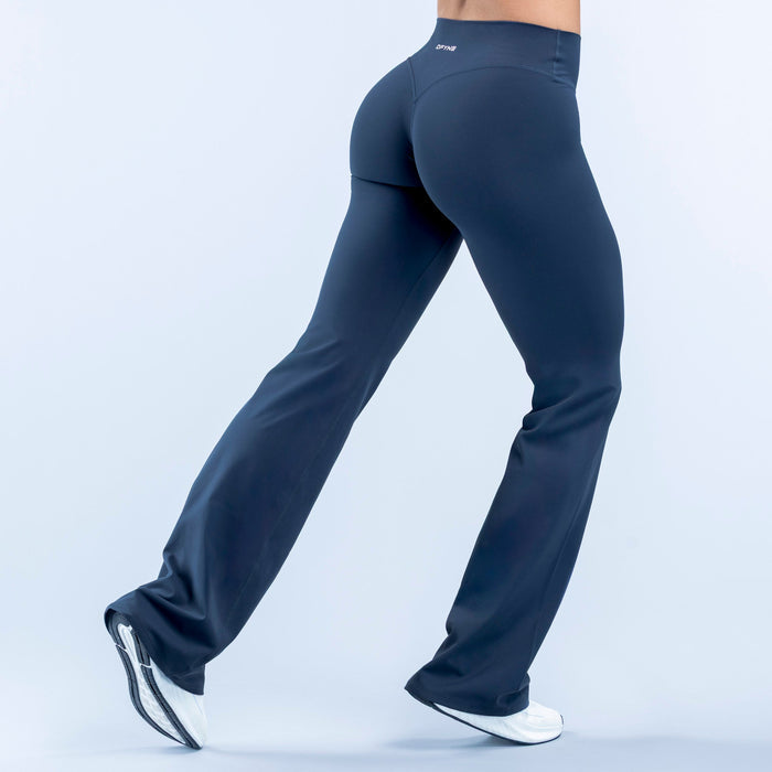 Dark blue flare leggings, back view; low waistband and wide bell bottoms