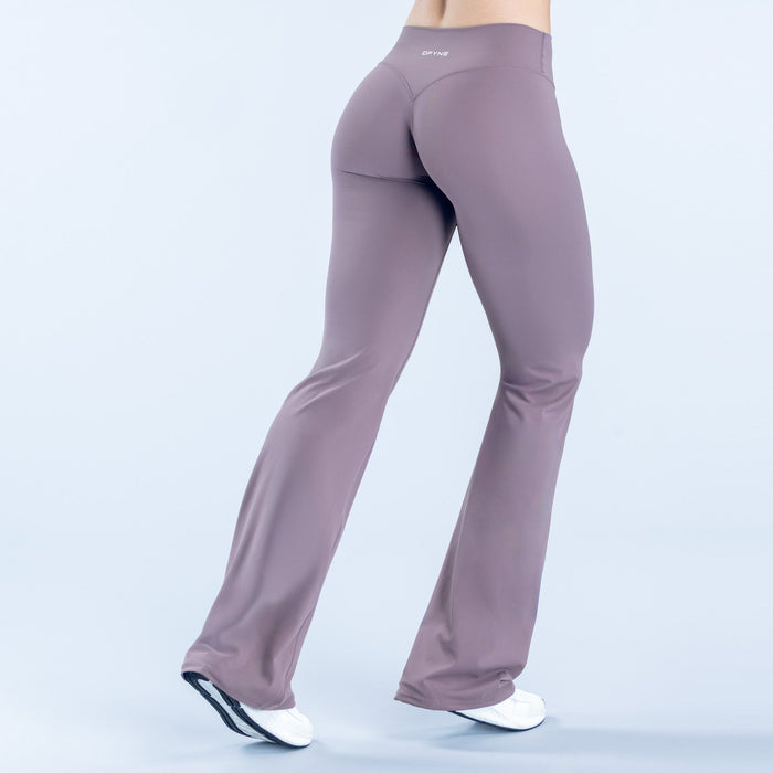 Women's flared leggings, mauve/purple, back view with wide bell hem