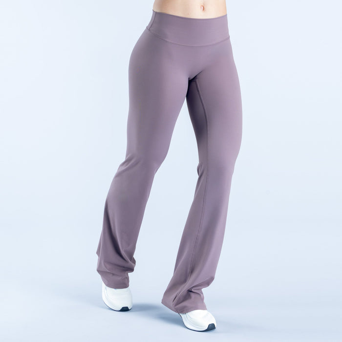 Women's flared leggings, mauve/purple, side view showing flared leg opening