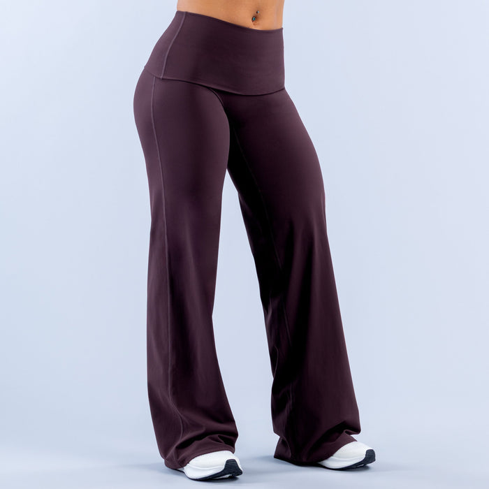 Purple wide-leg pants with fold-over waistband and relaxed straight-leg silhouette