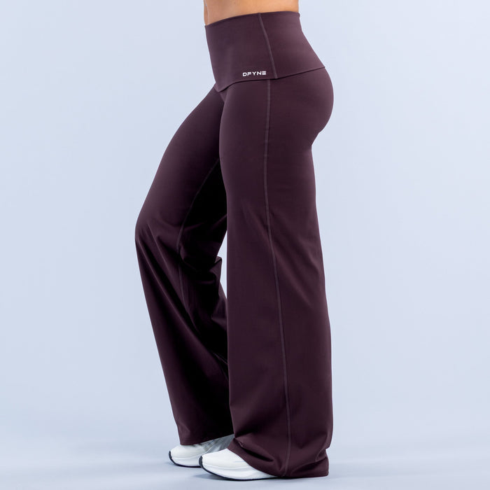 Purple fold-over wide-leg workout pants with high-rise waistband and visible side seams