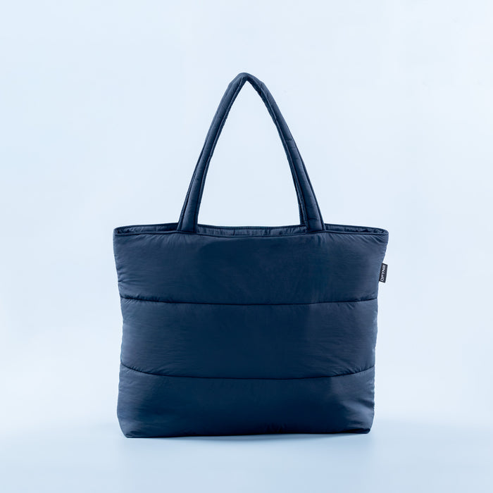 Navy puffer tote bag with wide top handles and side logo patch