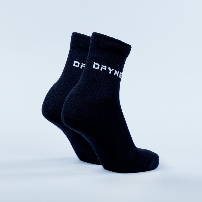 Dark navy quarter socks pair with ribbed cuffs and white logo lettering