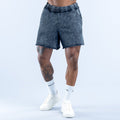 Washed navy-blue denim shorts with elastic waistband and side pockets