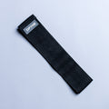 Black resistance band with small rectangular logo label