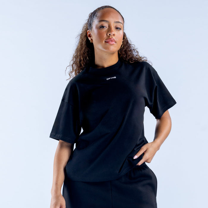 Women's boxy tee, dark color with short sleeves and small chest logo