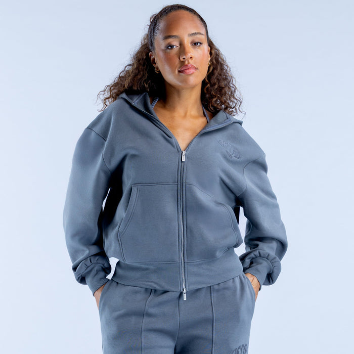 Blue zip-up hoodie with hood and front pockets, ribbed cuffs and hem