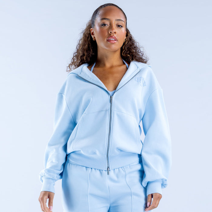 Light blue zip-up graphic hoodie with drawstring hood and front zipper