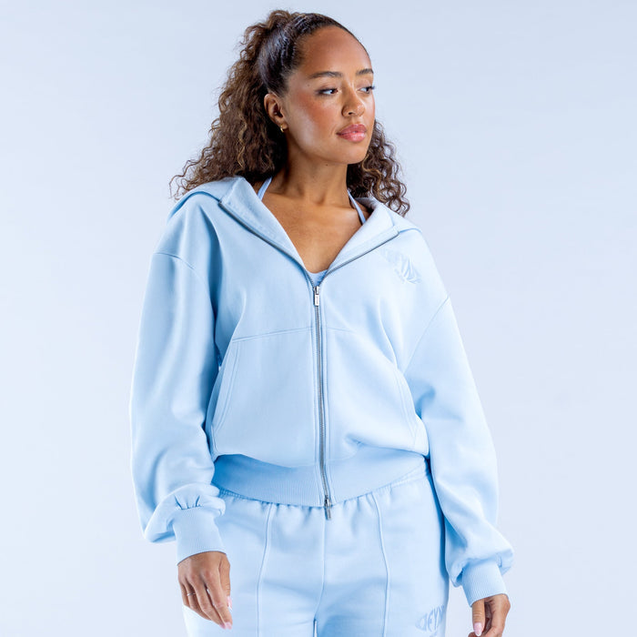 Light blue zip hoodie with drawstring hood, front zipper, and ribbed cuffs